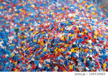Plastic colorful pieces recycling shredded for industrial use. Plastic colorful pieces recycling shredded for industrial use. 140510983