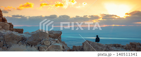 Beautiful sunrise over the Dead Sea. View from Masada fortress. Ruins of King Herod's palace in Judaean Desert Beautiful sunrise over the Dead Sea. View from Masada fortress. Ruins of King Herod's palace in Judaean Desert 140511341