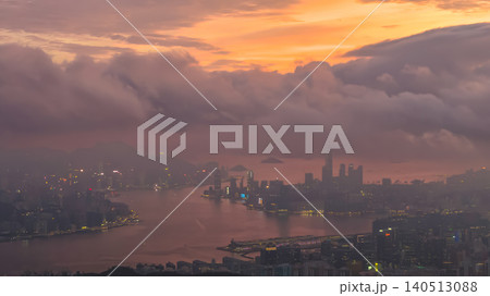 June 9 2022 plane view of HK. Golden Clouds Over Victoria Harbour Skyline 140513088