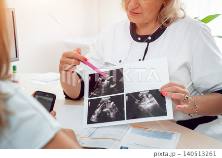 Doctor gynecologist consulting patient. Patient at doctor office. Diagnostic 140513261