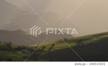 Cantabria mountains with green pastures and sunset mist Cantabria mountains with green pastures and sunset mist 140514101