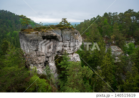 Rock city formations in Hruboskalsko, Bohemian Paradise (Cesky raj), Czech Republic, with peaks of giant sandstone rocks and cliffs emerging from light morning mist panoramic view Rock city formations in Hruboskalsko, Bohemian Paradise (Cesky raj), Czech Republic, with peaks of giant sandstone rocks and cliffs emerging from light morning mist panoramic view 140515619