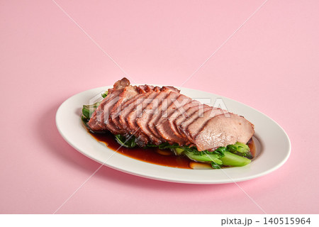 Tender char siu pork glazed with a sticky sweet sauce and slightly charred Tender char siu pork glazed with a sticky sweet sauce and slightly charred 140515964