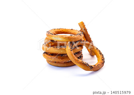 Crispy baked bagels with poppy seeds floating composition Crispy baked bagels with poppy seeds floating composition 140515979