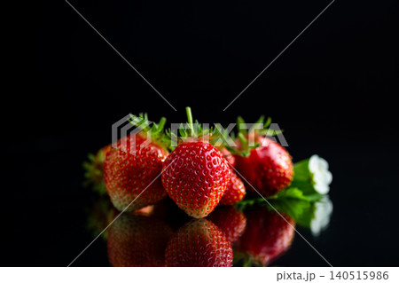 Fresh ripe strawberries with reflection on black background 140515986