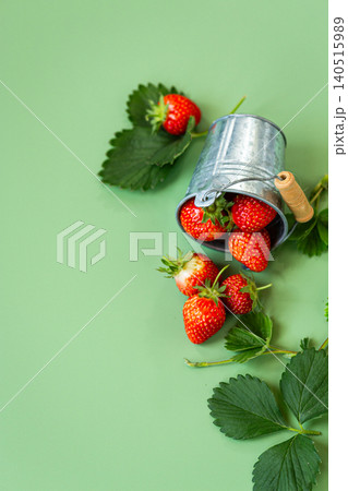 Juicy red strawberries with natural green foliage Juicy red strawberries with natural green foliage 140515989