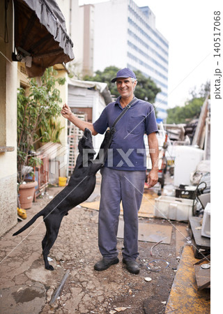 Man, dog and poor poverty in street, lower class and garbage or social economy. Smile, male person and friendly pet in alley with bad infrastructure city, third world or neighbourhood and pollution Man, dog and poor poverty in street, lower class and garbage or social economy. Smile, male person and friendly pet in alley with bad infrastructure city, third world or neighbourhood and pollution 140517068