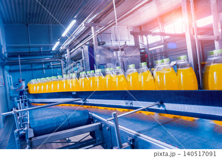 Beverage factory interior. Conveyor with bottles for juice or water. Equipments 140517091