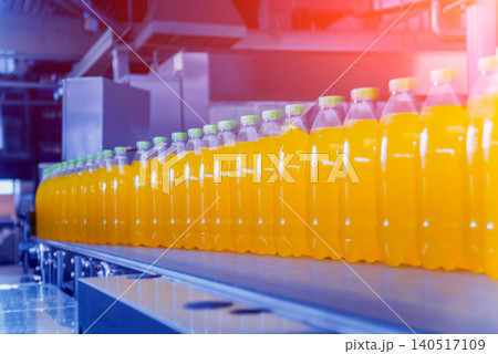 Beverage factory interior. Conveyor with bottles for juice or water. Equipments 140517109