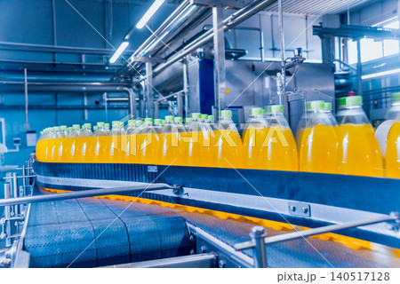 Beverage factory interior. Conveyor with bottles for juice or water. Equipments 140517128