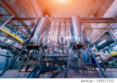 Modern interior of a brewery. Barrels and pipes. Factory interior. Modern interior of a brewery. Barrels and pipes. Factory interior. 140517132