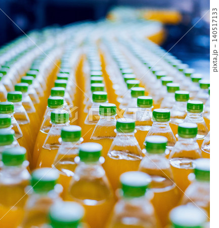 Conveyor with bottles for juice or water. Beverages factory equipments Conveyor with bottles for juice or water. Beverages factory equipments 140517133
