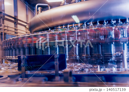 Automatic filling machine pours water into plastic PET bottles. Brewing production. Automatic filling machine pours water into plastic PET bottles. Brewing production. 140517139