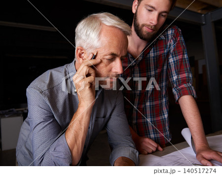 Architect, team and men with blueprint, thinking or plan for construction project with serious father teaching son. Engineer, apprentice and senior mentor with design for problem solving at workshop 140517274