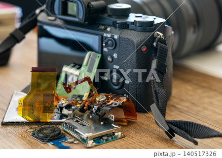 Repaired mirrorless camera with replaced electronic components displayed on workbench after service 140517326