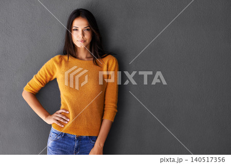 Portrait, fashion and woman in studio, edgy and cool or trendy style in gray background. Female model, proud and confidence or pride in mockup space, standing and stylish in casual outfit or clothes 140517356