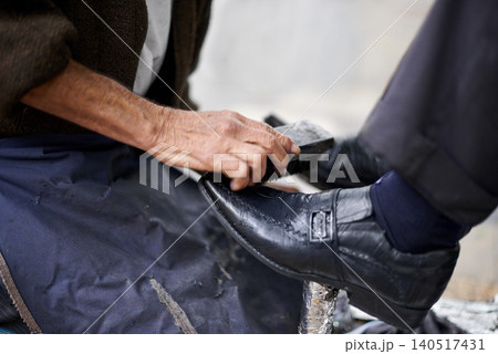 Hands, repairman and polishing shoes for customer in handcraft, startup business and store. Entrepreneur, shoemaker and service with client for leather footwear, skills and professional in street Hands, repairman and polishing shoes for customer in handcraft, startup business and store. Entrepreneur, shoemaker and service with client for leather footwear, skills and professional in street 140517431