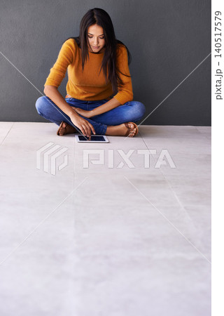 Tablet, app and woman on a floor with social media, scroll or elearning research on wall background space. Digital, mockup or lady student in a house with ebook search, course or online education Tablet, app and woman on a floor with social media, scroll or elearning research on wall background space. Digital, mockup or lady student in a house with ebook search, course or online education 140517579