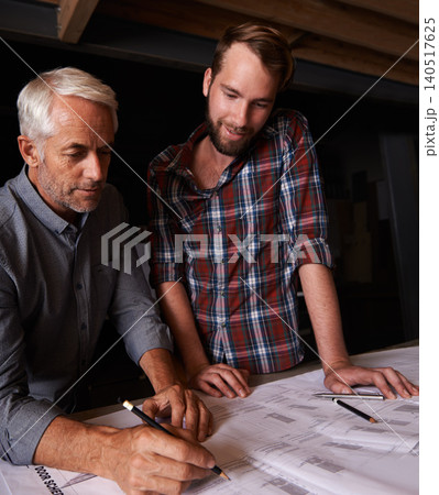 Architects, engineering and men with blueprint in office for building, construction or repairs. Team, design and industrial apprentice planning and working on industry project with mentor in workshop 140517625