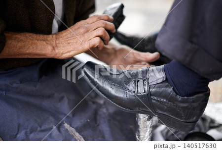 Street, polish or hands of man with shoes in cleaning service in city for shining with wax, trade and job. Closeup, customer or person with brush in downtown for business, footwear or outdoor help Street, polish or hands of man with shoes in cleaning service in city for shining with wax, trade and job. Closeup, customer or person with brush in downtown for business, footwear or outdoor help 140517630