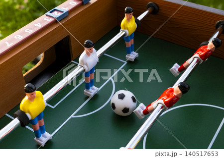 Table football with plastic soccer players, highlighting color driven identity of the national football teams at the World Cup. Table football with plastic soccer players, highlighting color driven identity of the national football teams at the World Cup. 140517653