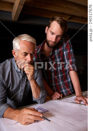 Engineer, team and men with blueprint, thinking or plan for construction with serious father teaching son. Architecture, apprentice and senior mentor drawing design for problem solving in workshop Engineer, team and men with blueprint, thinking or plan for construction with serious father teaching son. Architecture, apprentice and senior mentor drawing design for problem solving in workshop 140517676
