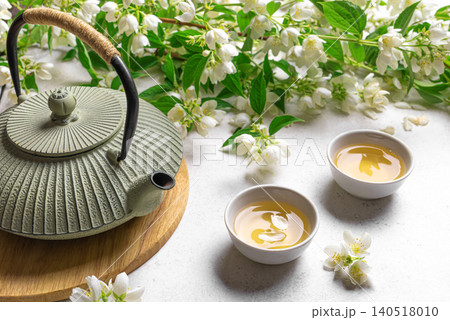 Green jasmine tea and flowers Green jasmine tea and flowers 140518010