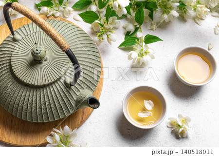 Green jasmine tea and flowers Green jasmine tea and flowers 140518011