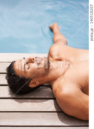 Pool, deck and man relax in summer with happiness at hotel, resort or peace at villa in Miami for vacation. Calm, holiday and person lying at water in sunshine at poolside with smile in Florida Pool, deck and man relax in summer with happiness at hotel, resort or peace at villa in Miami for vacation. Calm, holiday and person lying at water in sunshine at poolside with smile in Florida 140518207