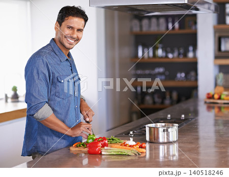 Cooking, portrait and happy man chopping vegetables on kitchen counter for healthy diet, nutrition or lunch. Cutting knife, food and face of person preparing fresh salad for organic meal in home Cooking, portrait and happy man chopping vegetables on kitchen counter for healthy diet, nutrition or lunch. Cutting knife, food and face of person preparing fresh salad for organic meal in home 140518246