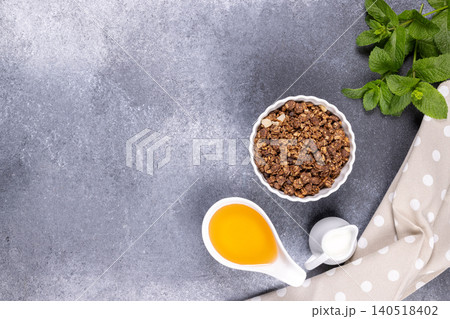 Healthy chocolate granola with honey, milk, and mint 140518402