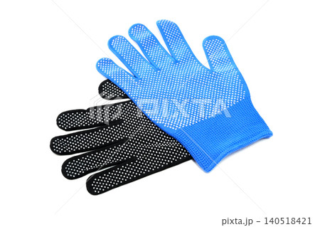 blue work glove lying on top of a black work glove on a white isolated background 140518421