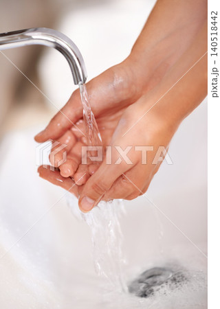Person, water and soap on hands for cleaning in skincare, routine or grooming in home closeup. Bathroom, tap or washing skin with foam for sanitary protection of hygiene from germs, bacteria or virus Person, water and soap on hands for cleaning in skincare, routine or grooming in home closeup. Bathroom, tap or washing skin with foam for sanitary protection of hygiene from germs, bacteria or virus 140518442