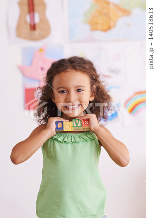 Girl, smile and learn with blocks in portrait, child development and growth with letters. Female person, kid and abc or alphabet for language, kindergarten and creative game for education at school Girl, smile and learn with blocks in portrait, child development and growth with letters. Female person, kid and abc or alphabet for language, kindergarten and creative game for education at school 140518613