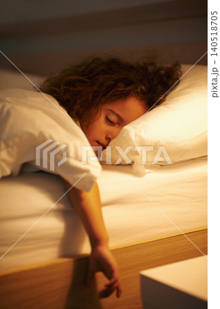 Girl, sleeping and relax in bed at night, comfortable and tired or dream on pillow in home. Female person, child and resting in bedroom or lying for peace, exhausted and fatigue or blanket for calm 140518705