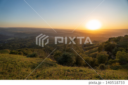 View of the mountains and Kislovodsk from the observation decks of the Kislovodsk Park. Evening sunset over the mountains of Kislovodsk. View of the mountains and Kislovodsk from the observation decks of the Kislovodsk Park. Evening sunset over the mountains of Kislovodsk. 140518733
