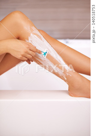 Hand, legs and shaving with razor hair removal for cleaning maintenance for beauty treatment, routine or morning. Fingers, bathtub and soap in apartment with hygiene tools, product or transformation Hand, legs and shaving with razor hair removal for cleaning maintenance for beauty treatment, routine or morning. Fingers, bathtub and soap in apartment with hygiene tools, product or transformation 140518753