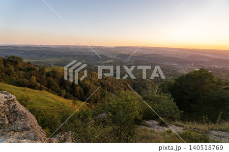 View of the mountains and Kislovodsk from the observation decks of the Kislovodsk Park. Evening sunset over the mountains of Kislovodsk. 140518769