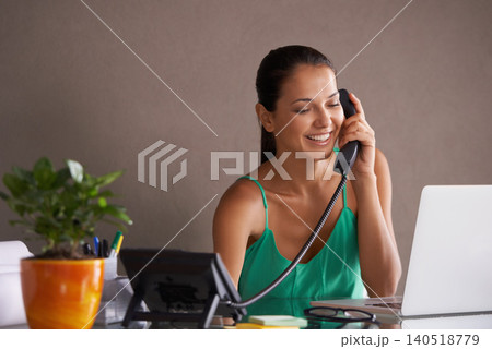 Phone call, remote work and landline with woman secretary in office for communication or reception. Laptop, smile and happy young receptionist answering telephone for small business or startup Phone call, remote work and landline with woman secretary in office for communication or reception. Laptop, smile and happy young receptionist answering telephone for small business or startup 140518779
