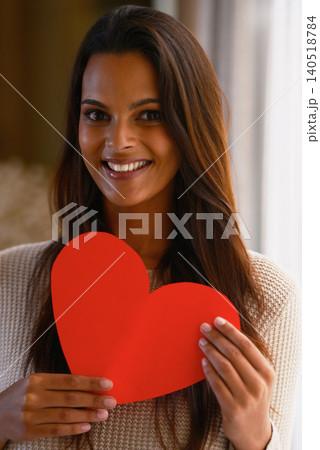 Woman, portrait and heart paper for kindness, care and love emoji for valentines day in home. Female person, happy and romance aesthetic or review and sign, shape and icon for peace or compassion Woman, portrait and heart paper for kindness, care and love emoji for valentines day in home. Female person, happy and romance aesthetic or review and sign, shape and icon for peace or compassion 140518784