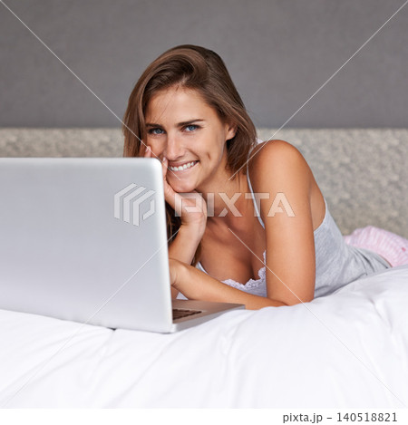 Portrait, woman and happy with laptop on bed, weekend and relax with online movies in home. Young lady, smile face and rest on bed with computer and streaming subscription or social media in house 140518821
