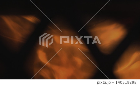 Intimate Atmosphere Created By Amber Embers Softly Pulsing Beneath Metal Lattice In Cozy Retreat. Media 140519298