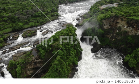 Stunning Aerial Perspective Capturing Forceful Waterfall Flowing Through Jagged Canyon Formations. Media Stunning Aerial Perspective Capturing Forceful Waterfall Flowing Through Jagged Canyon Formations. Media 140519337