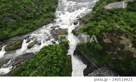 Aerial View Of Rocky Cascade, Overhead Perspective Of Waterfall With Surrounding Greenery And Mist. Media Aerial View Of Rocky Cascade, Overhead Perspective Of Waterfall With Surrounding Greenery And Mist. Media 140519423