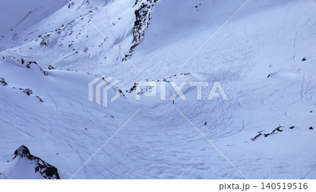 Tranquil Snow Covered Hillside With Rocks. Calm Icy Mountain Slope Bathed In Delicate Blue Rays Of Light. Media Tranquil Snow Covered Hillside With Rocks. Calm Icy Mountain Slope Bathed In Delicate Blue Rays Of Light. Media 140519516