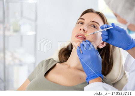 Facial injection young patient, closeup 140523711