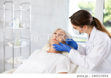 Facial injection mature patient Facial injection mature patient 140523954
