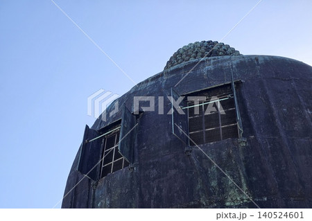 Rear View of the Great Buddha Statue of Kamakura (Kamakura Daibutsu) showing Open Windows at Kotoku-in Temple, Famous Bronze Buddhist Sculpture in Kanagawa, Japan. Rear View of the Great Buddha Statue of Kamakura (Kamakura Daibutsu) showing Open Windows at Kotoku-in Temple, Famous Bronze Buddhist Sculpture in Kanagawa, Japan. 140524601