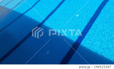 Blue swimming pool water with light and shadow contrast 140525387