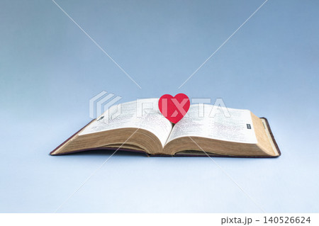Red paper heart on top of wooden cross crucifix Red paper heart on top of wooden cross crucifix 140526624